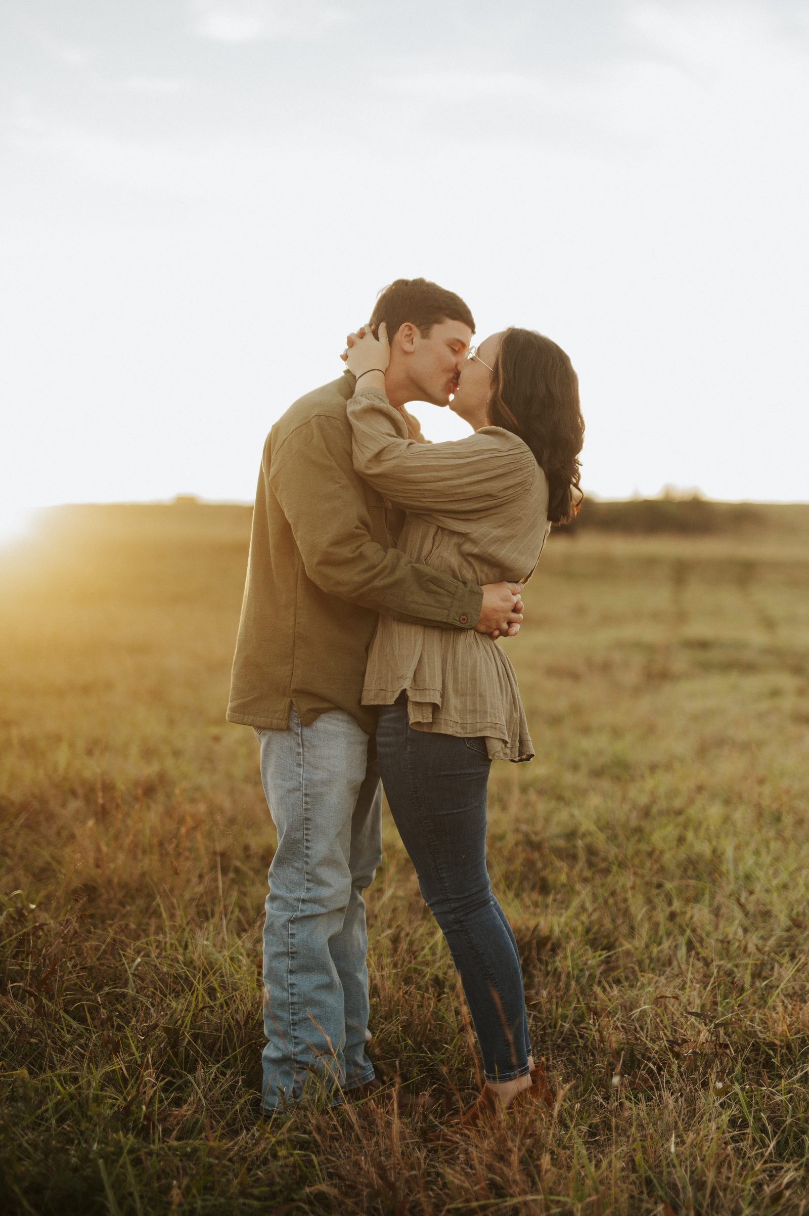 Couples photography session in a golden field at sunset