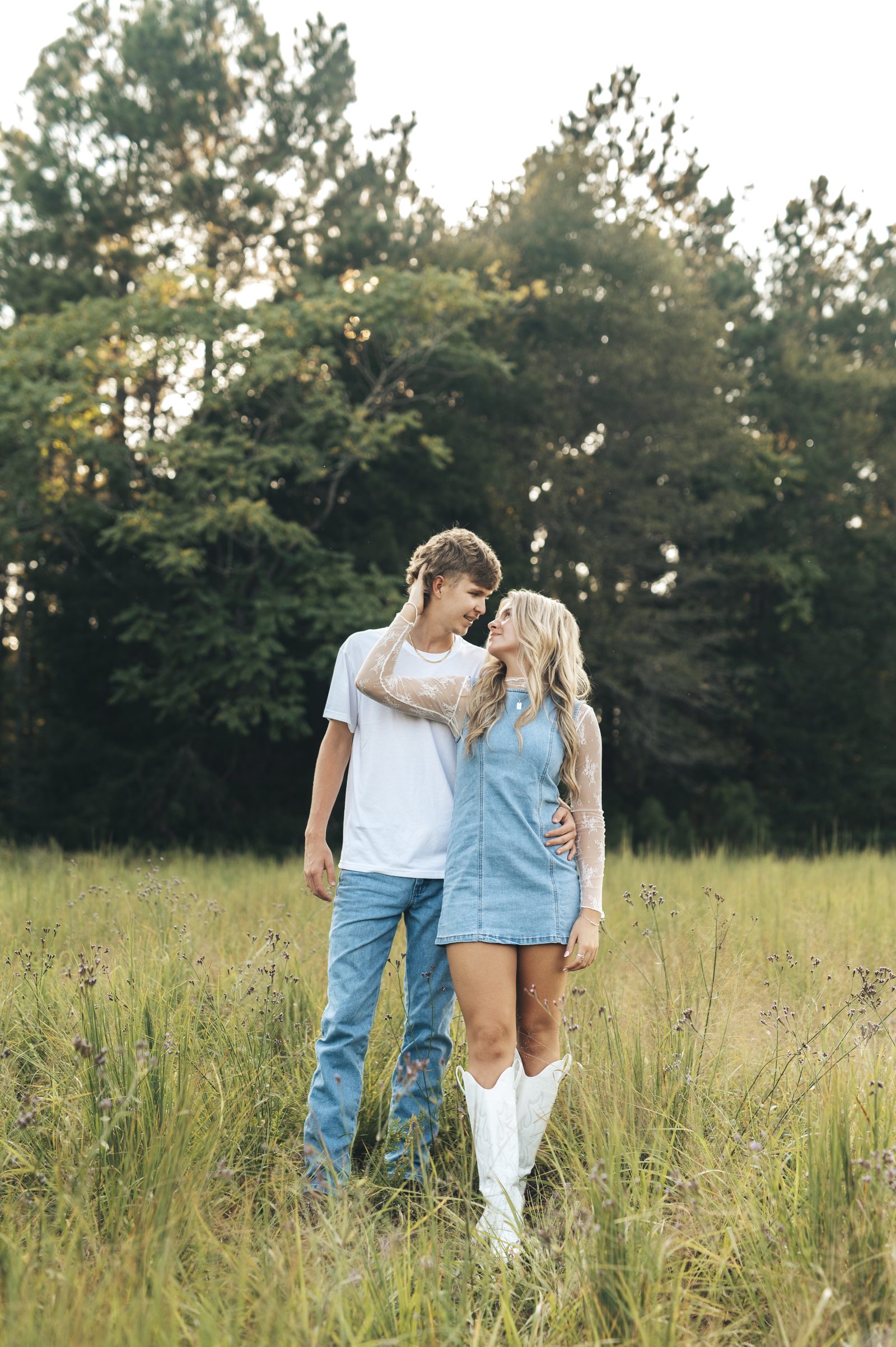 Couple laughing in a wildflower field