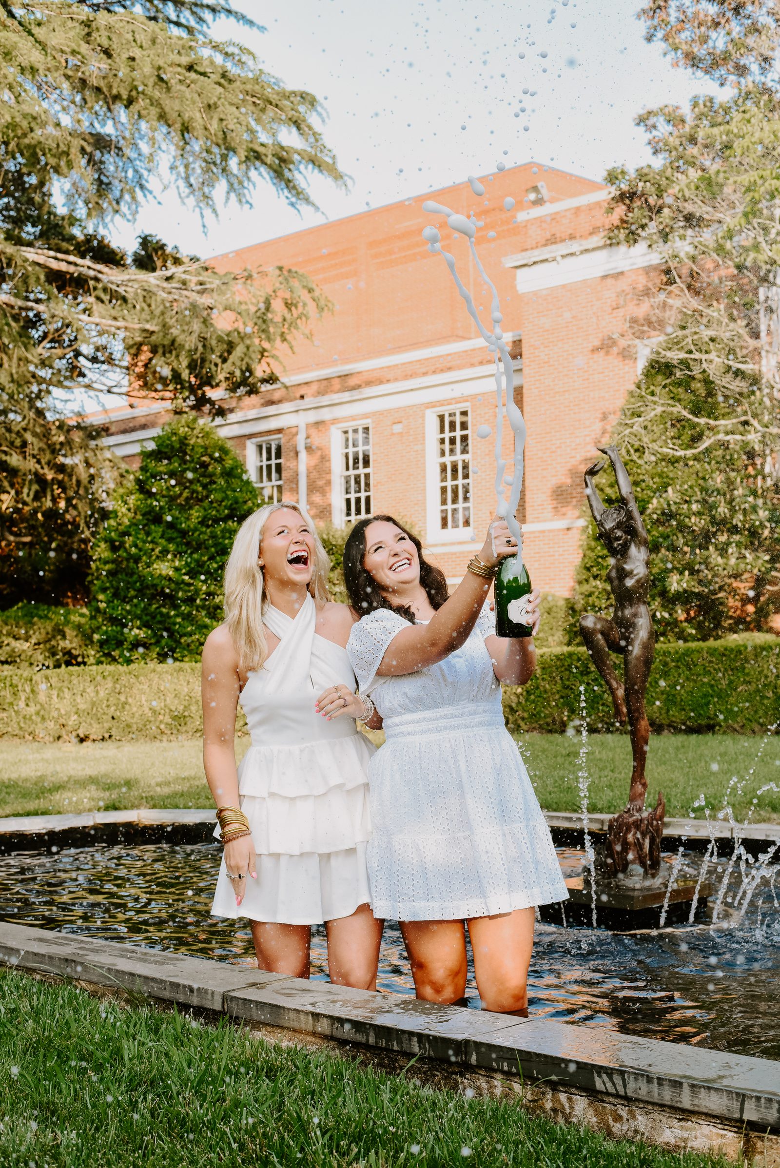 Best friends photography session in matching white dresses